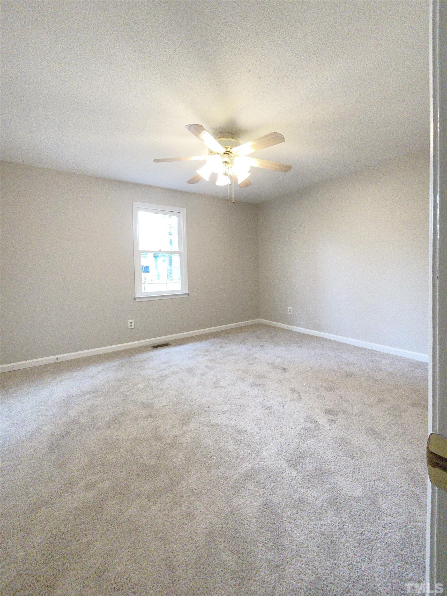 7316 Ewing Place Raleigh, NC 27616 - Photo 5 of 19 a view of empty room with window