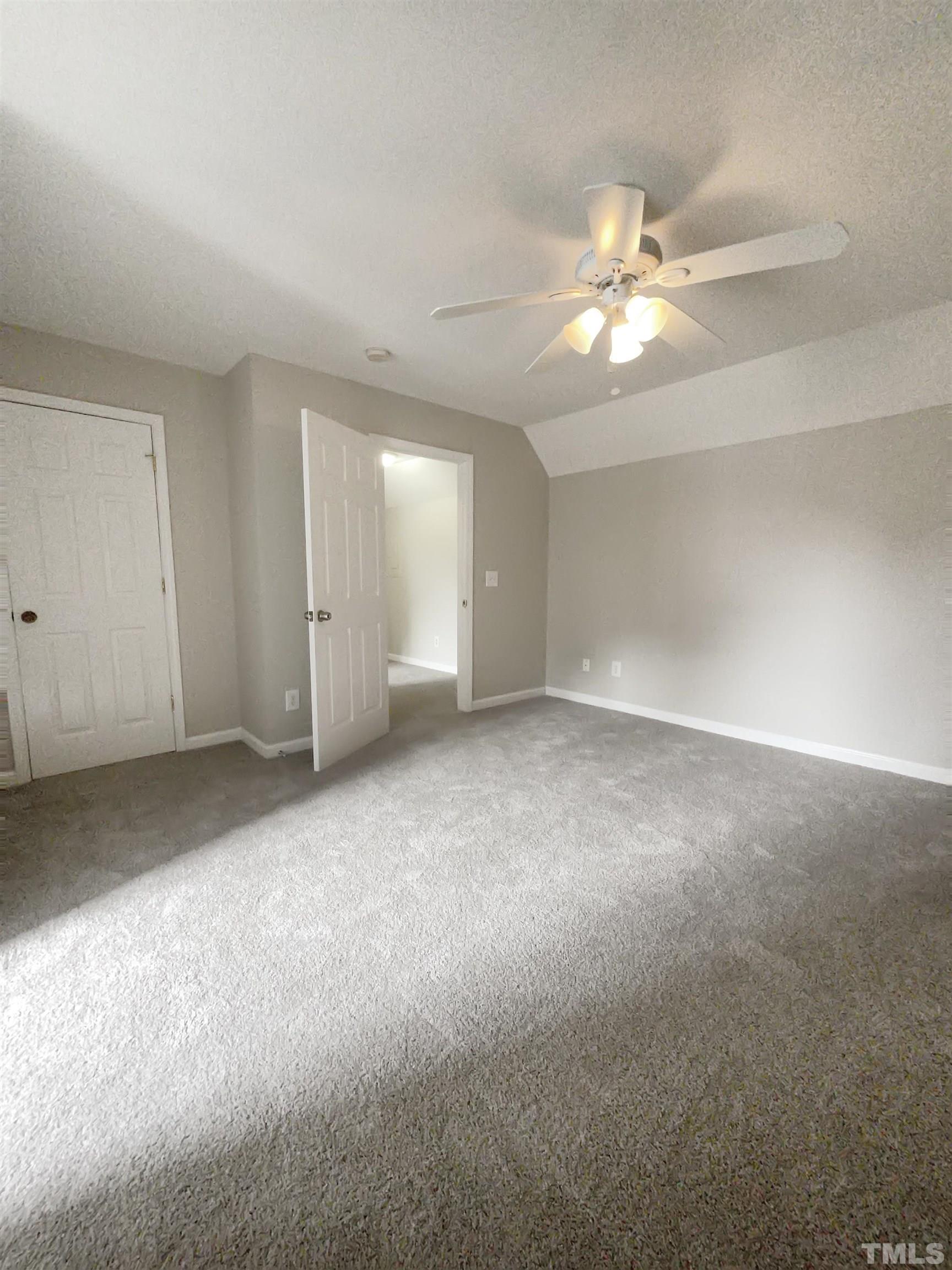 7316 Ewing Place Raleigh, NC 27616 - Photo 10 of 19 a view of an empty room with a fan