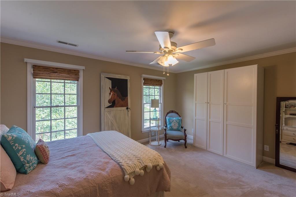 1511 Carters Grove Road Clemmons, NC 27012 - Photo 21 of 30 Second Bedroom showing the extra storage, plus a closet.