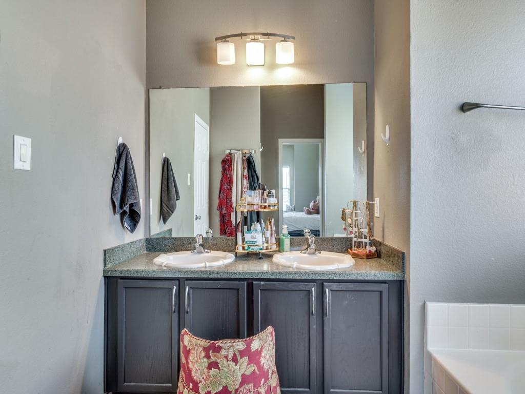 305 Sheridan Road Oak Point, TX 75068 - Photo 15 of 25 a bathroom with a sink vanity and a mirror