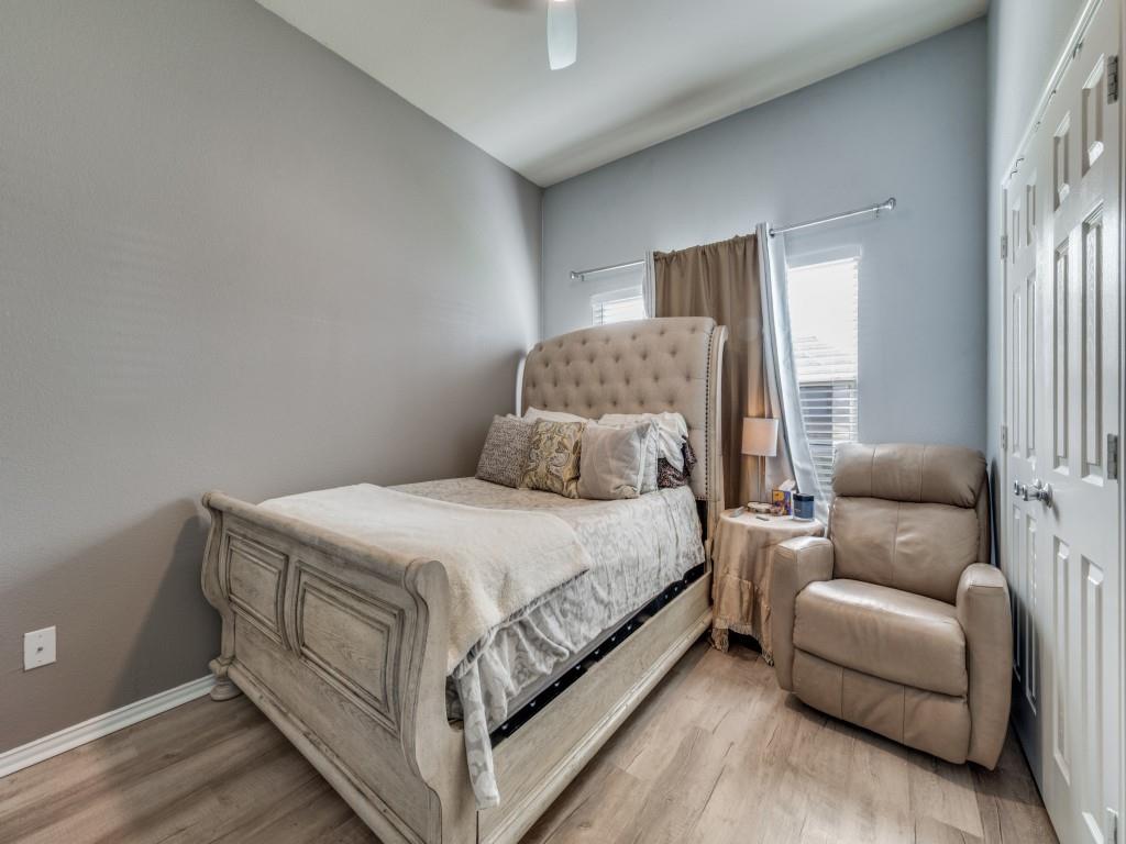 305 Sheridan Road Oak Point, TX 75068 - Photo 17 of 25 a bedroom with a bed couch and a window