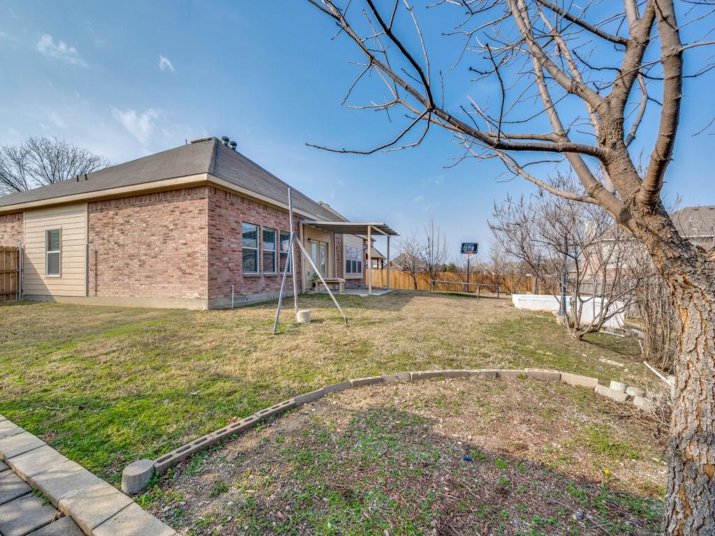 305 Sheridan Road Oak Point, TX 75068 - Photo 23 of 25 a view of a house with a yard