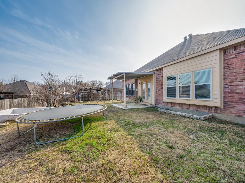 305 Sheridan Road Oak Point, TX 75068 - Photo 24 of 25 a view of a house with backyard and sitting area