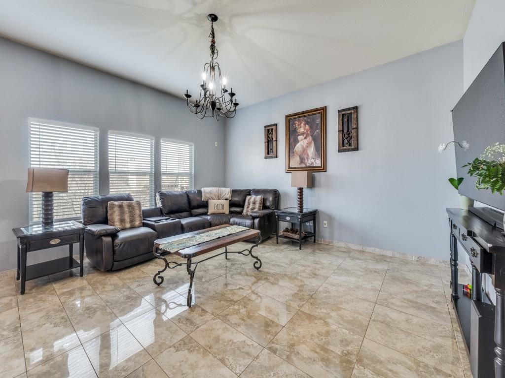 305 Sheridan Road Oak Point, TX 75068 - Photo 6 of 25 a living room with furniture a chandelier and a window