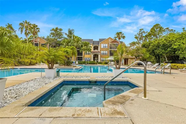 a swimming pool with outdoor seating and yard