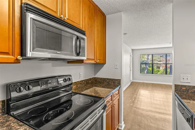 a kitchen with a stove and a microwave
