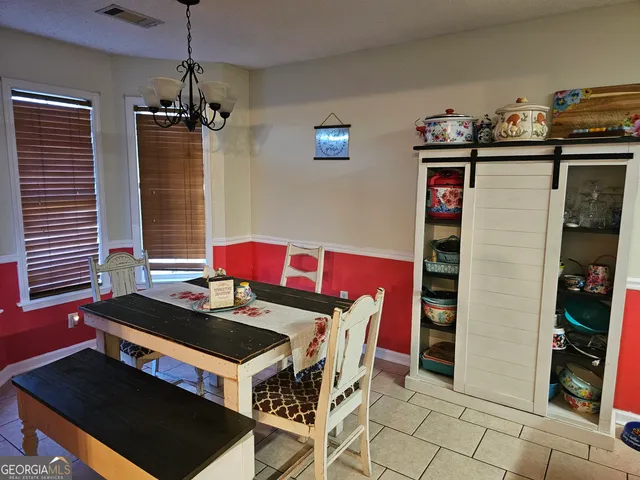 a kitchen with stainless steel appliances granite countertop a stove and a refrigerator