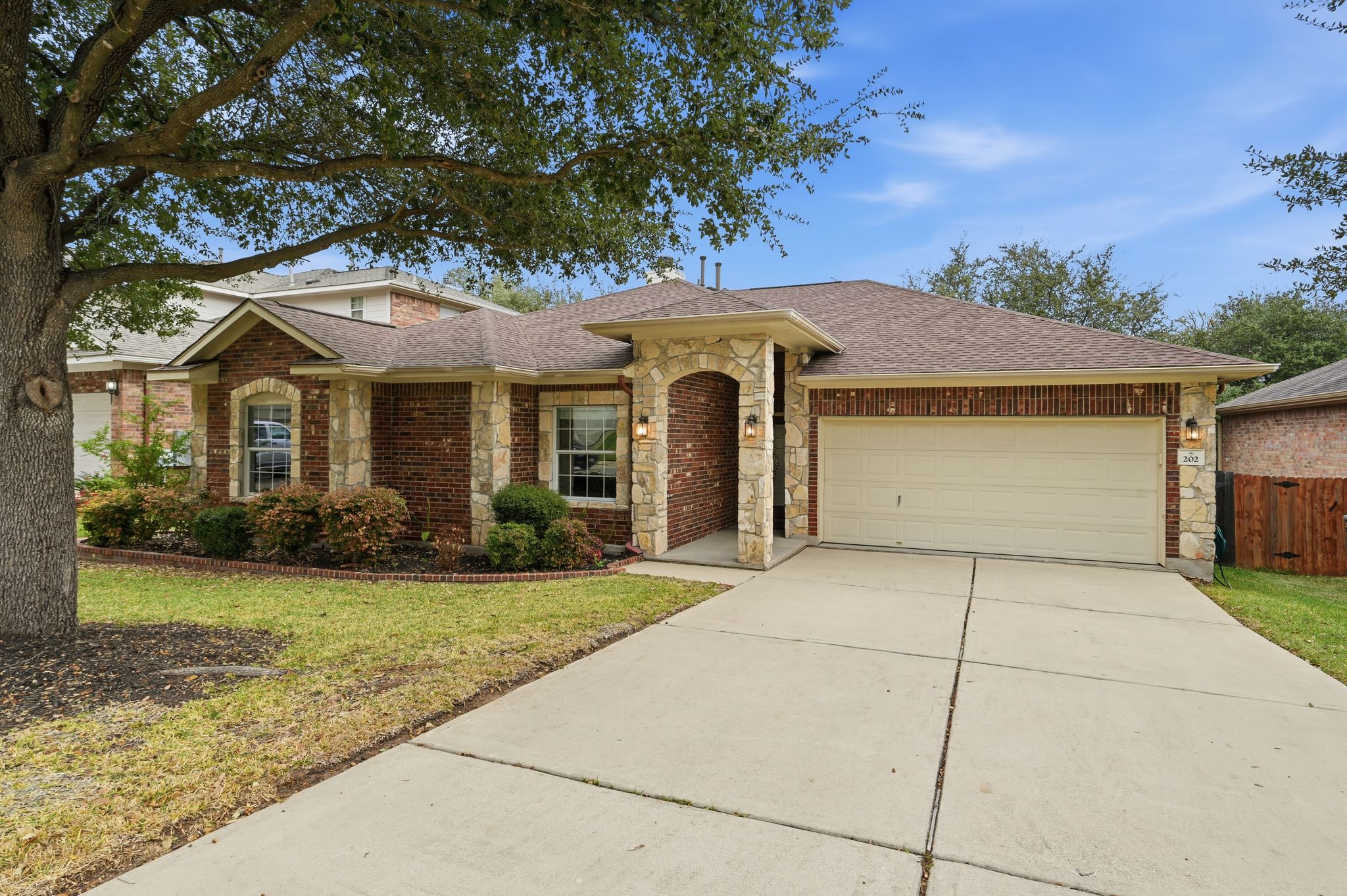 202 Muscovy Lane Cedar Park, TX 78613 - Photo 1 of 34 a front view of a house with garden
