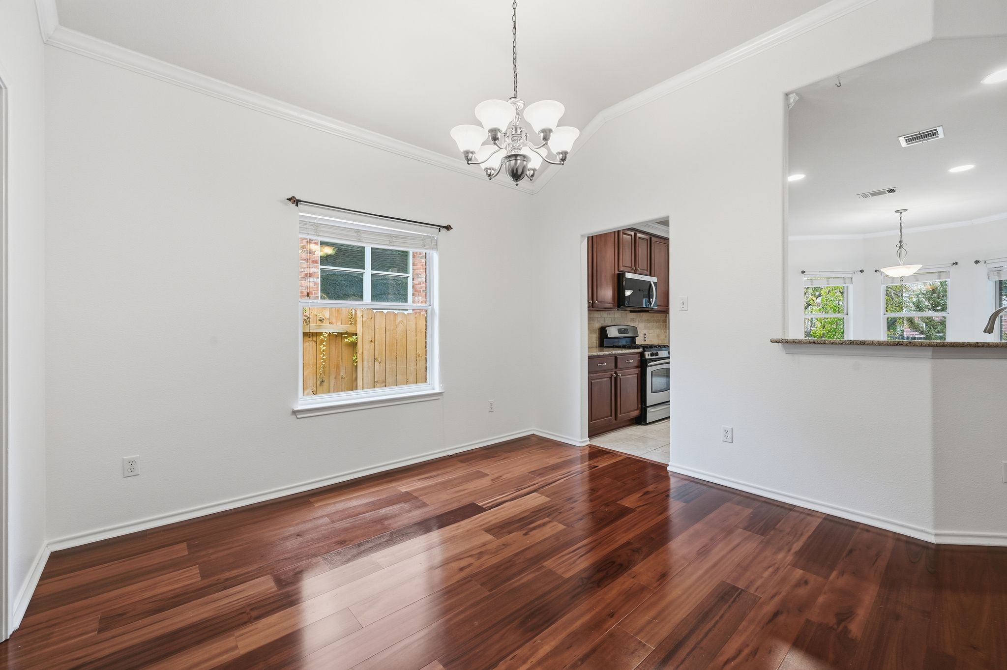 202 Muscovy Lane Cedar Park, TX 78613 - Photo 11 of 34 a view of an empty room with window and wooden floor