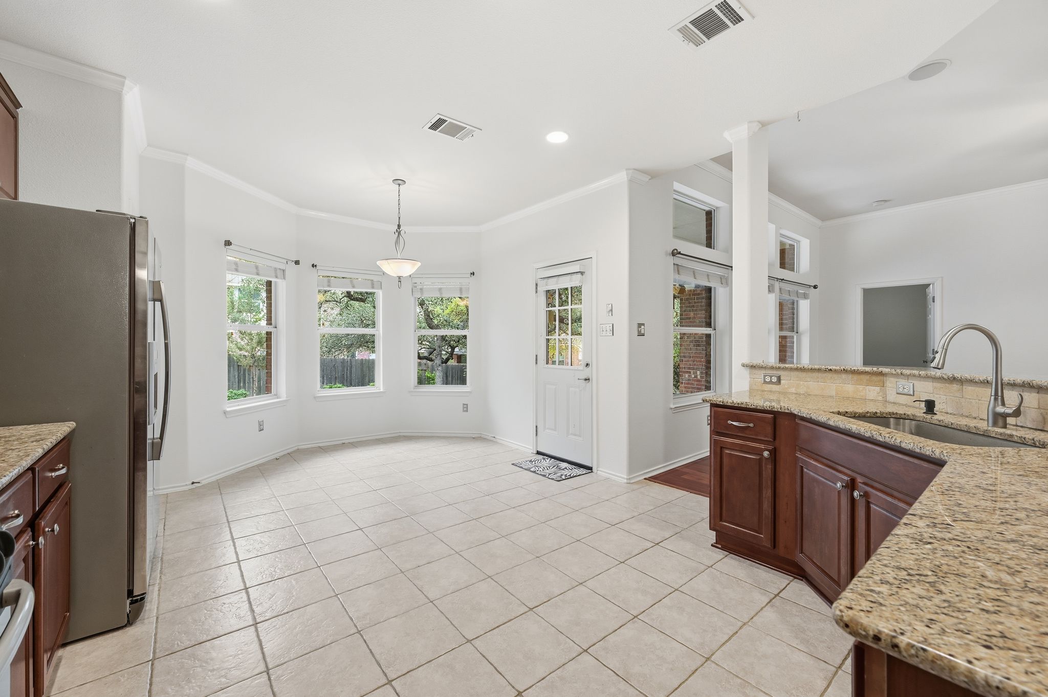 202 Muscovy Lane Cedar Park, TX 78613 - Photo 13 of 34 a large kitchen with a sink stainless steel appliances a counter space and a window