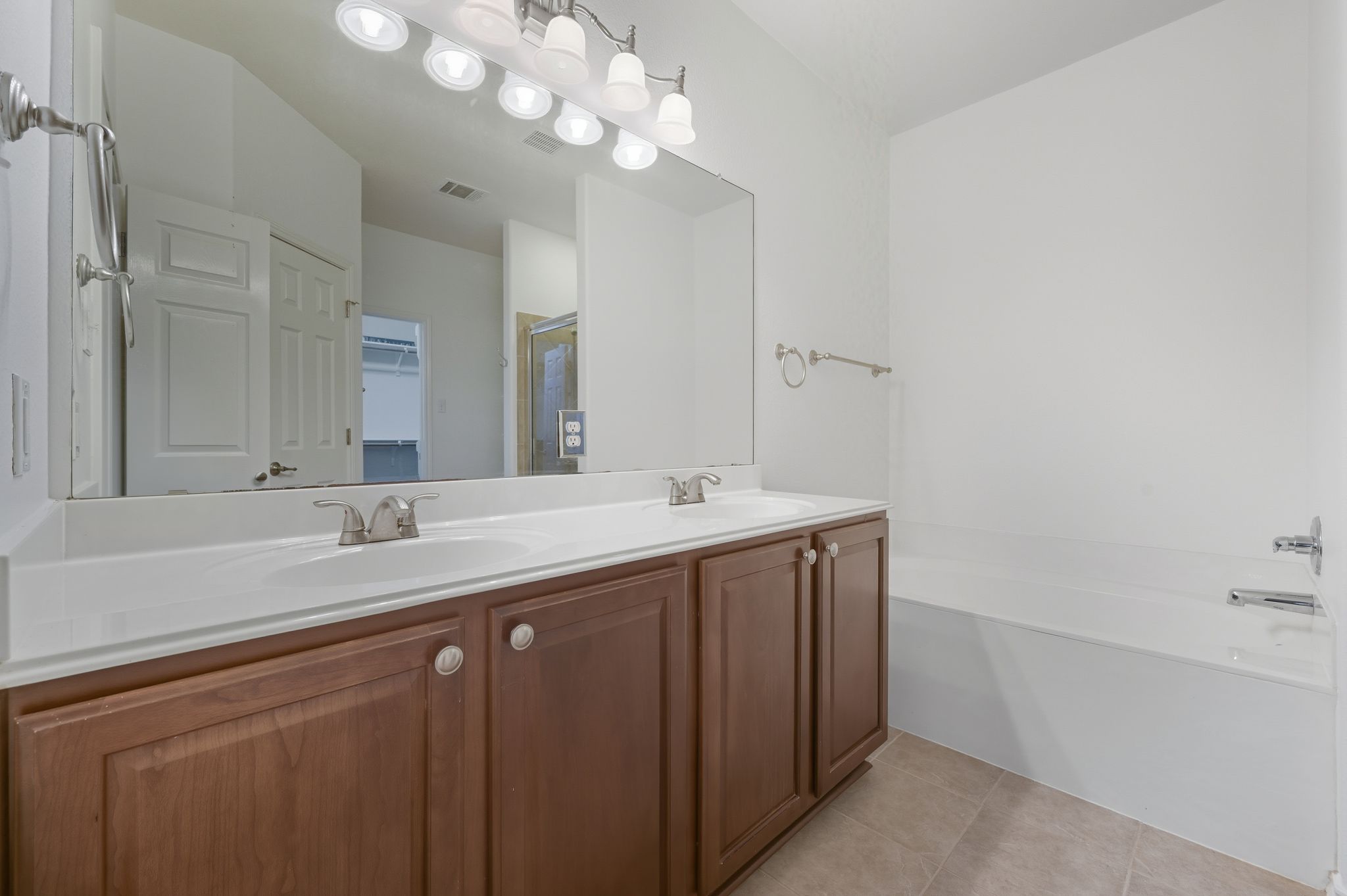 202 Muscovy Lane Cedar Park, TX 78613 - Photo 16 of 34 a bathroom with a sink a large mirror and vanity
