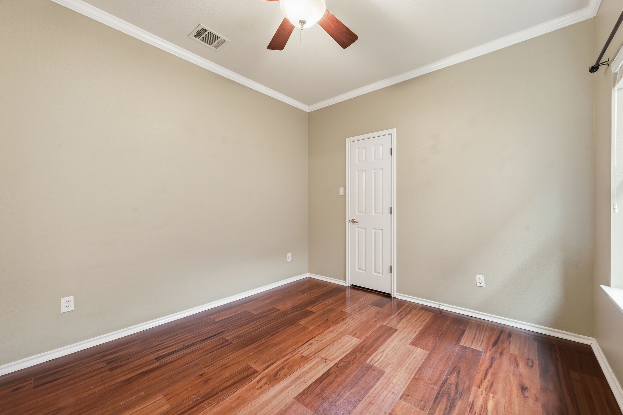202 Muscovy Lane Cedar Park, TX 78613 - Photo 21 of 34 an empty room with wooden floor and windows