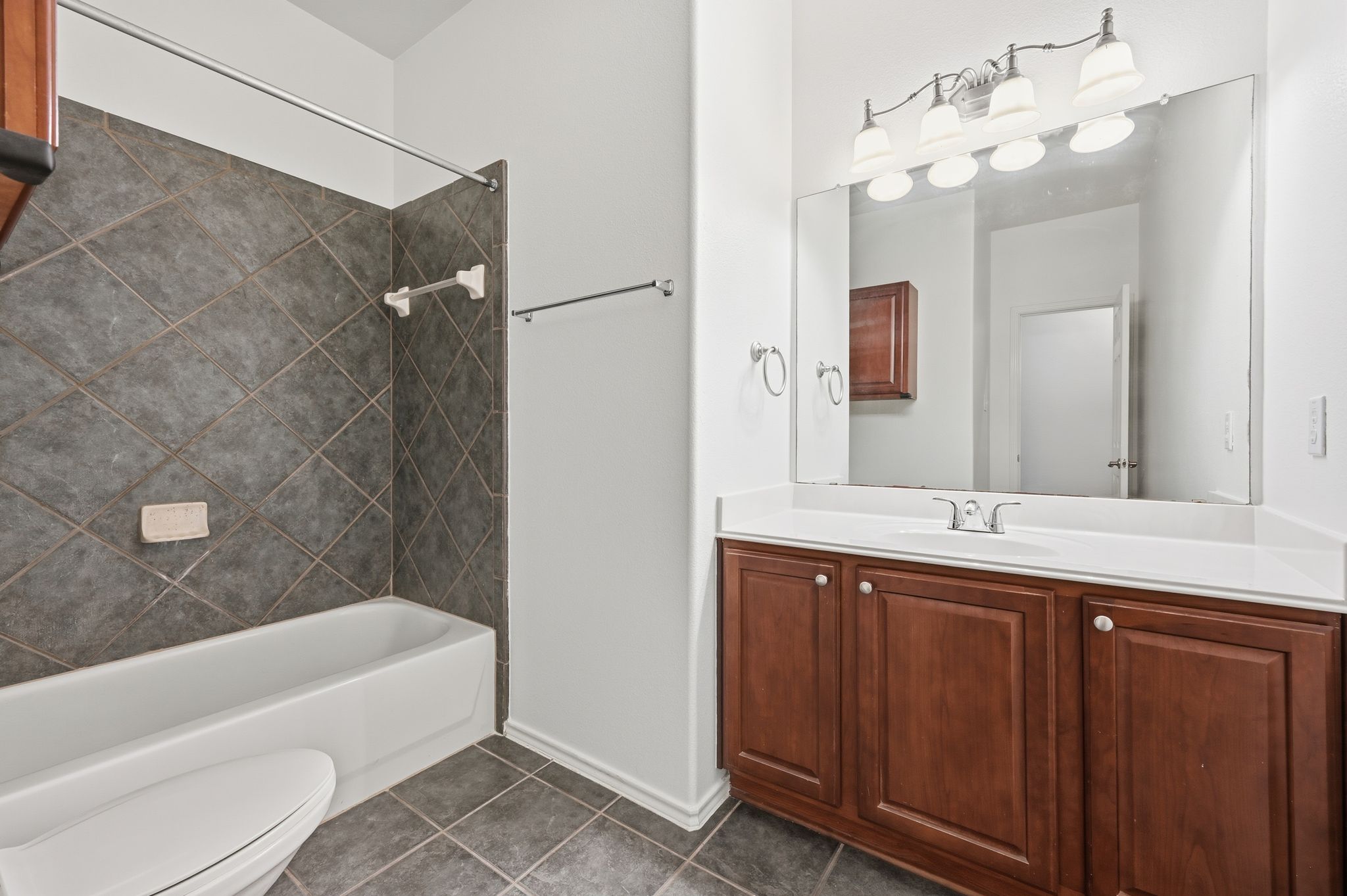 202 Muscovy Lane Cedar Park, TX 78613 - Photo 26 of 34 a bathroom with a double vanity sink mirror and bathtub