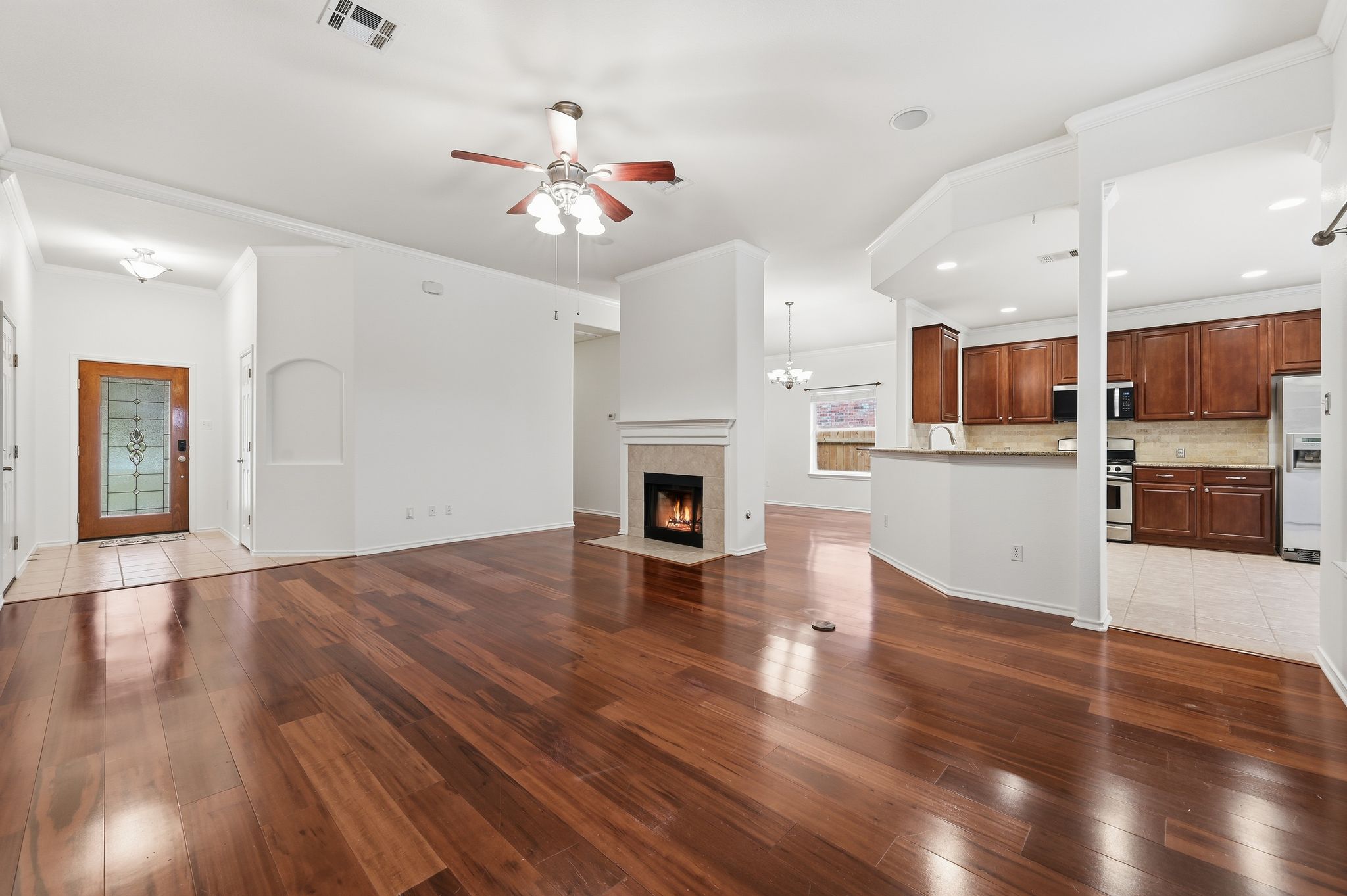 202 Muscovy Lane Cedar Park, TX 78613 - Photo 3 of 34 a view of a kitchen with a stove cabinets and wooden floor