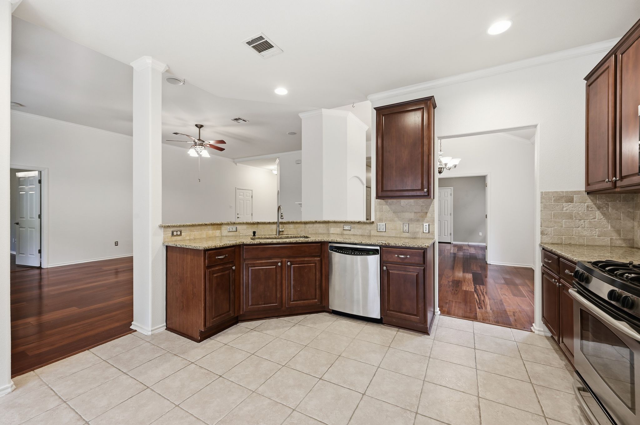 202 Muscovy Lane Cedar Park, TX 78613 - Photo 7 of 34 a large kitchen with granite countertop a stove and a sink