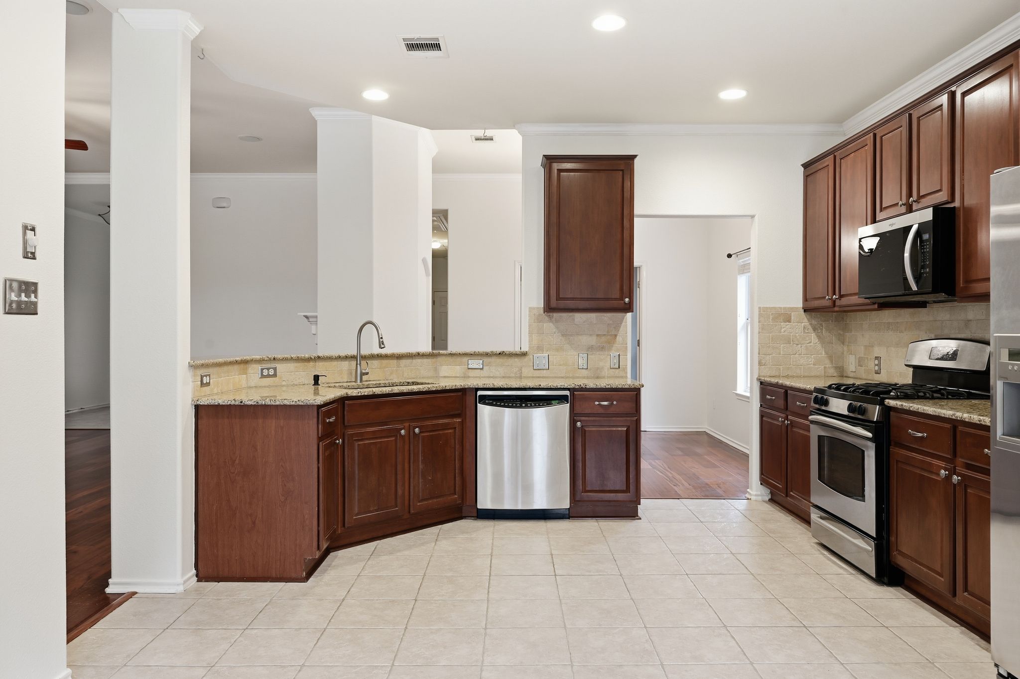 202 Muscovy Lane Cedar Park, TX 78613 - Photo 9 of 34 a large kitchen with stainless steel appliances granite countertop a refrigerator and a stove top oven
