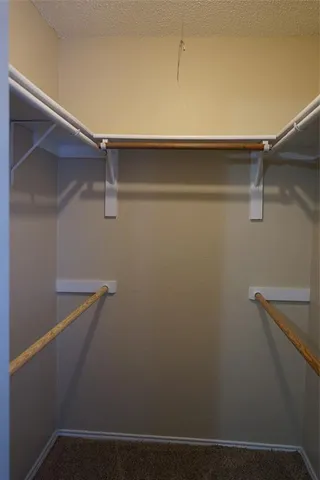 a view of a room with shelf on the wall