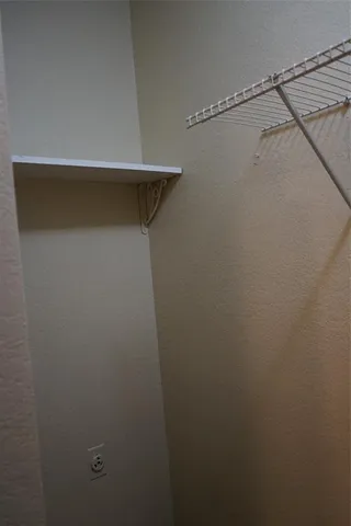 a view of a room with racks on the wall