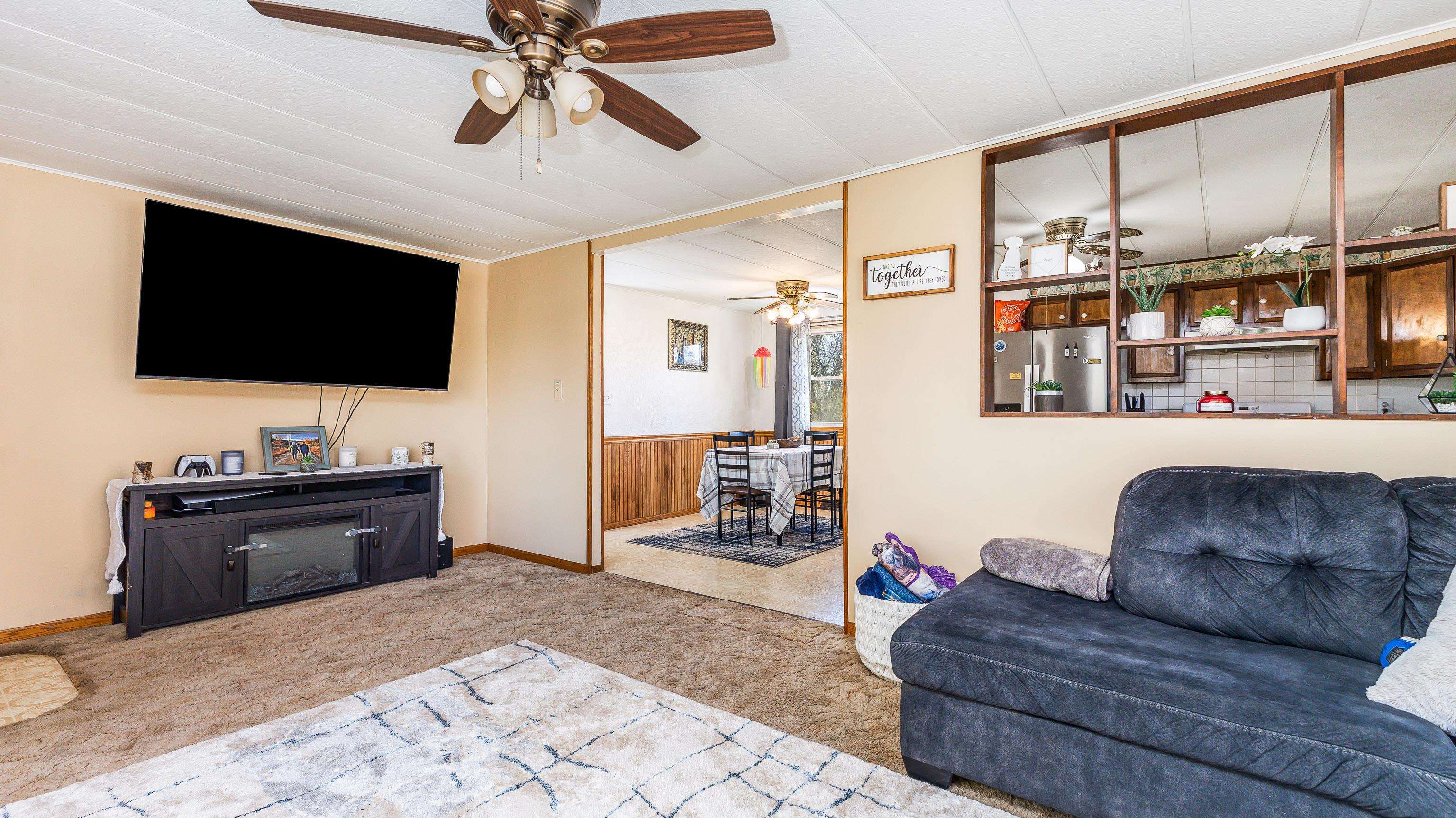 620 Clinton Street Galena, IL 61036 - Photo 14 of 37 a living room with furniture and a flat screen tv