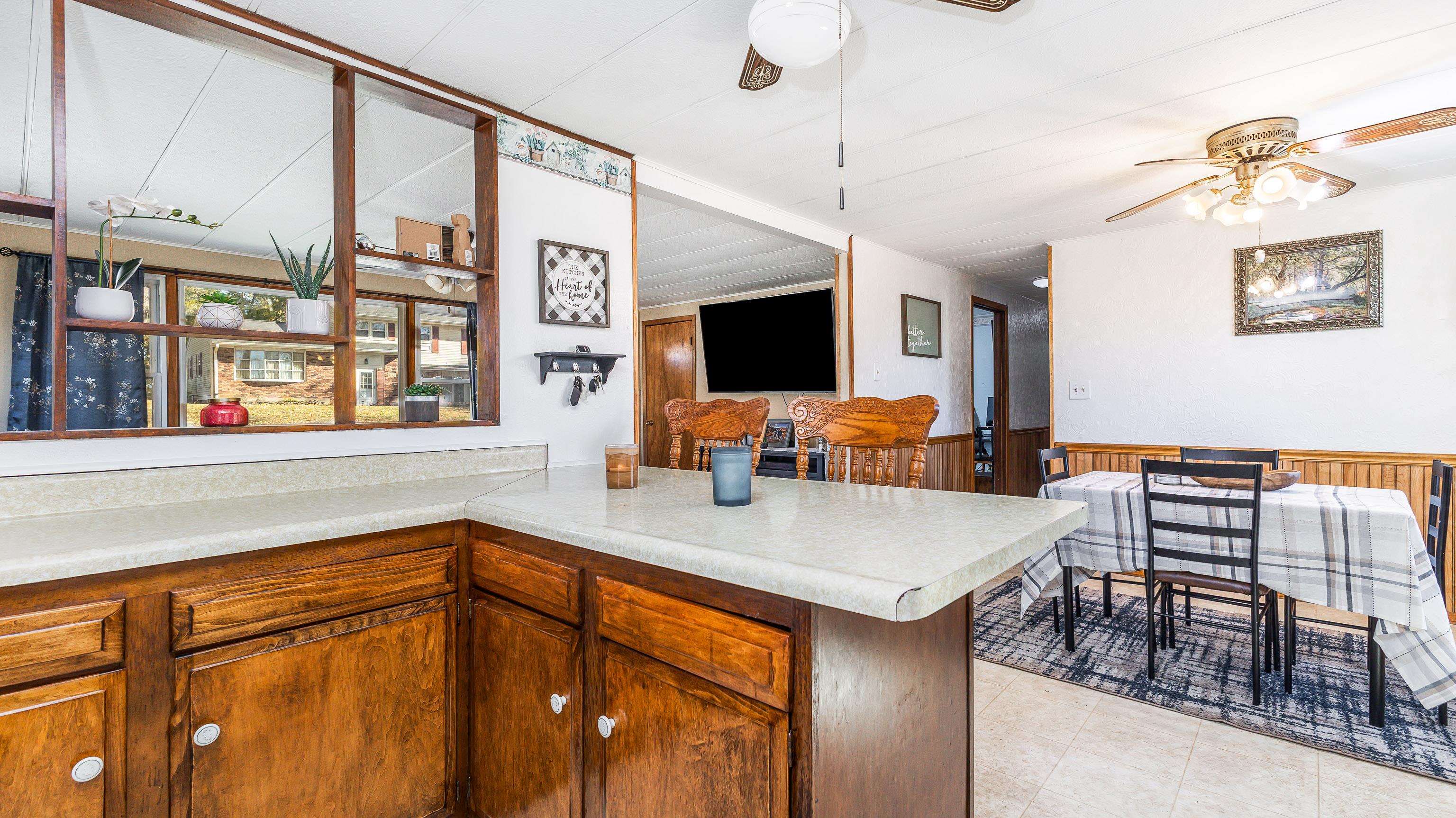 620 Clinton Street Galena, IL 61036 - Photo 14 of 37 a kitchen with a table chairs and a refrigerator