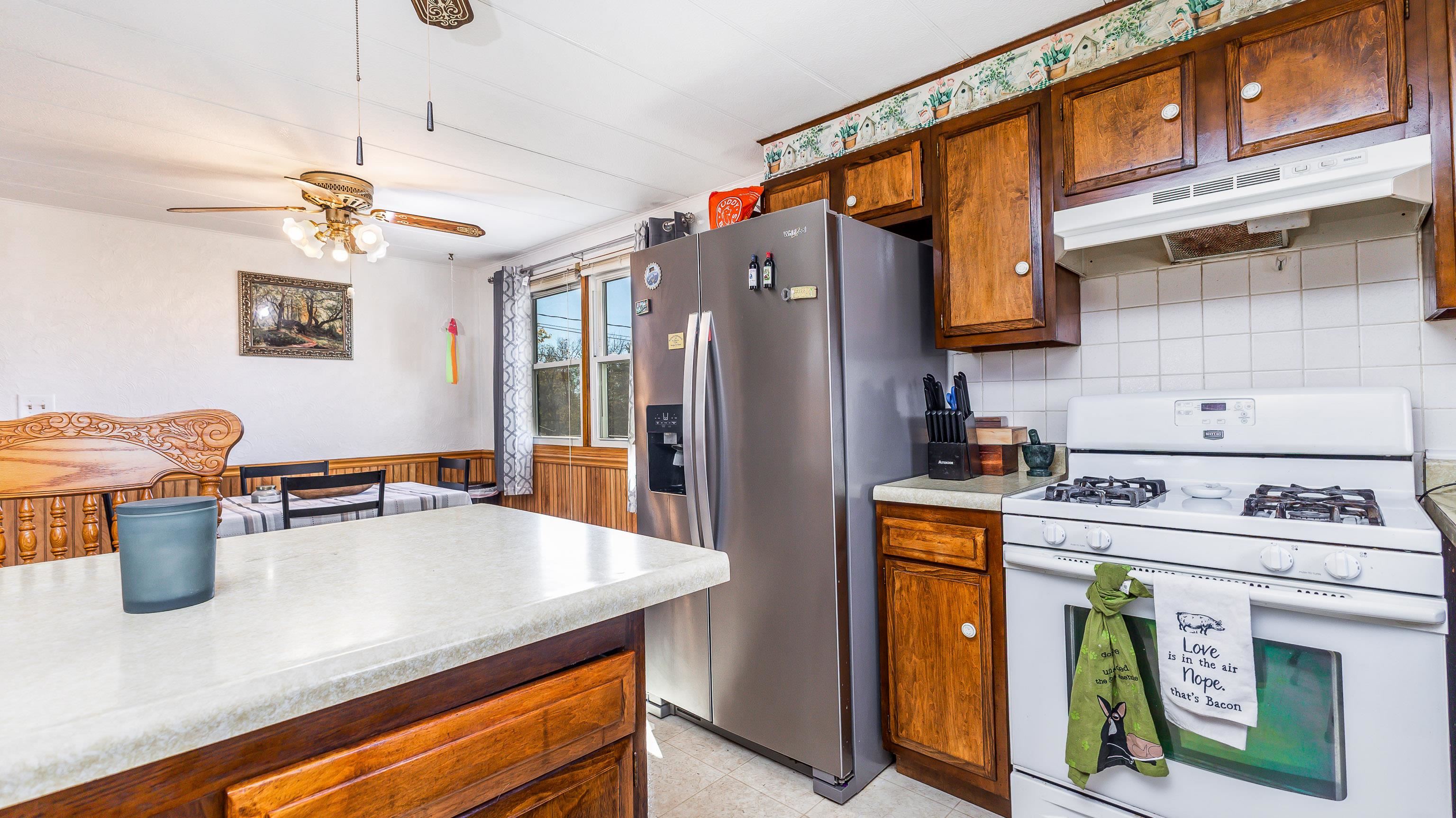 620 Clinton Street Galena, IL 61036 - Photo 15 of 37 a kitchen with a stove a refrigerator and a sink