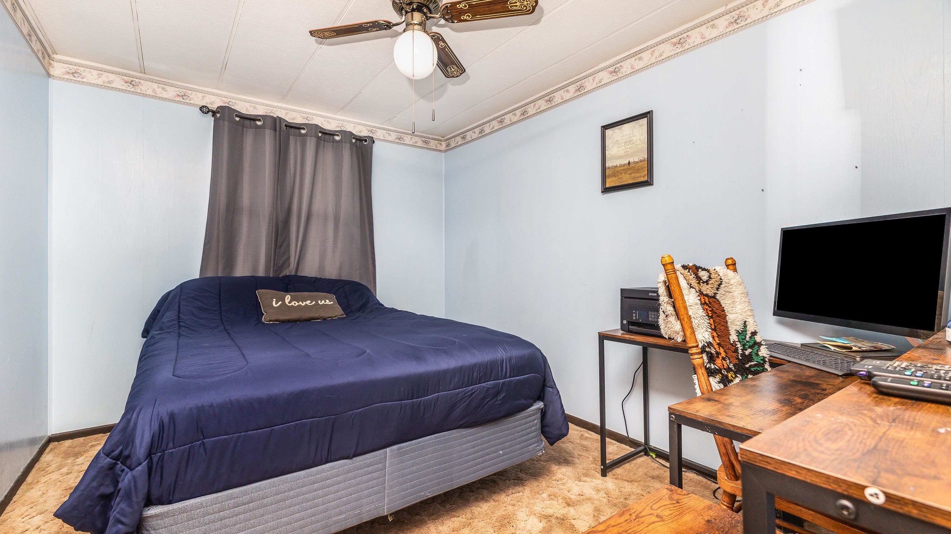 620 Clinton Street Galena, IL 61036 - Photo 17 of 37 a bedroom with a bed and a flat screen tv