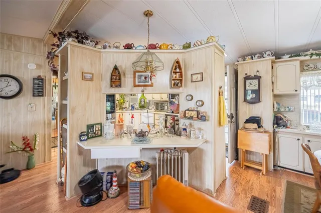 a view of a livingroom with furniture and hardwood floor