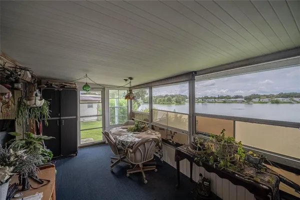 a view of swimming pool with furniture
