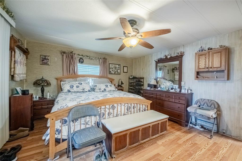 2055 South Floral Avenue, Unit 306 Bartow, FL 33830 - Photo 20 of 42 a bedroom with a bed and wooden floor