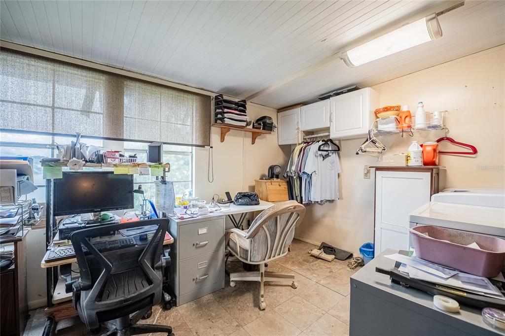 2055 South Floral Avenue, Unit 306 Bartow, FL 33830 - Photo 28 of 42 a view of a workspace with furniture and a window