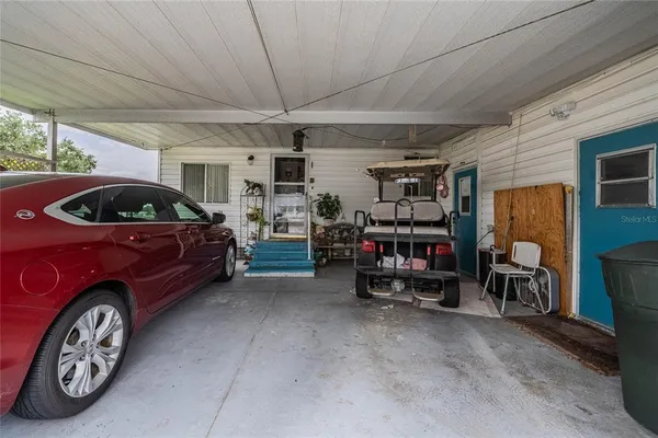 a view of parking garage with cars parked