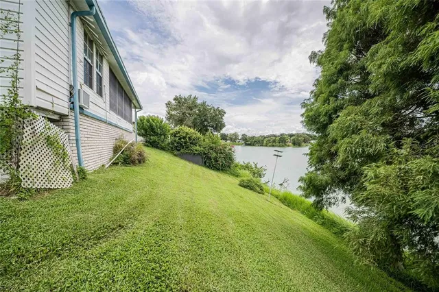a backyard of a house with lots of green space