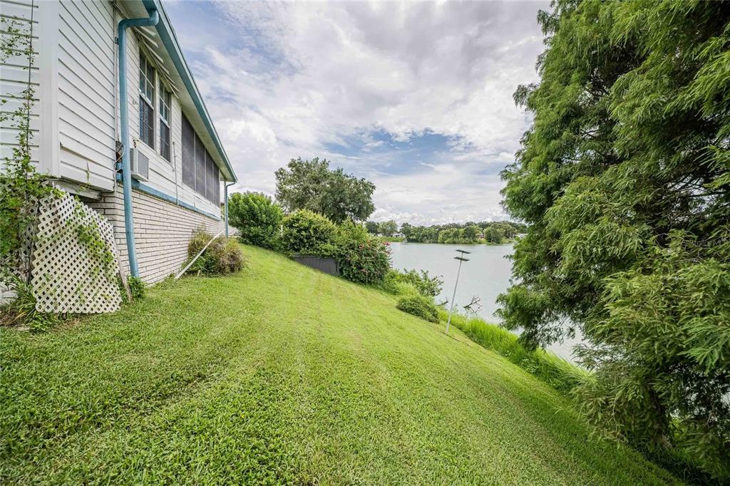2055 South Floral Avenue, Unit 306 Bartow, FL 33830 - Photo 33 of 42 a backyard of a house with lots of green space