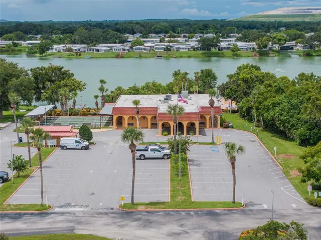 an aerial view of a house with lake view