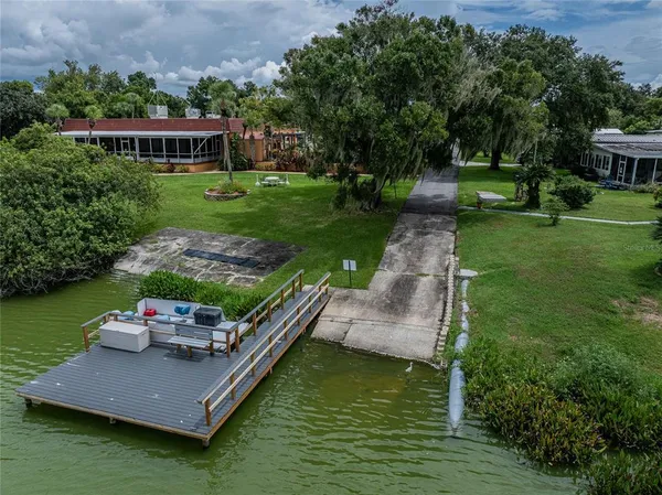 a view of a house with pool yard and a garden
