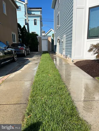 a view of a car park in front of a house