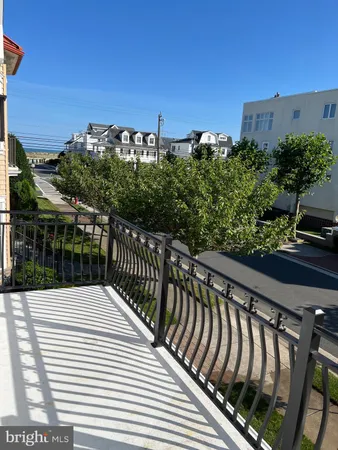 a view of balcony with wooden floor and city view