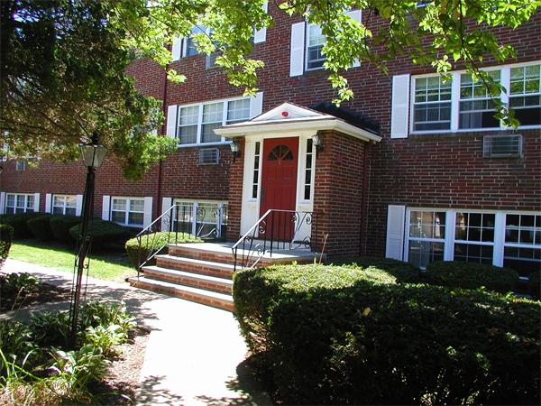 9 Cass Street, Unit 2 Boston, MA 02132 - Photo 1 of 5 a front view of a house with a garden