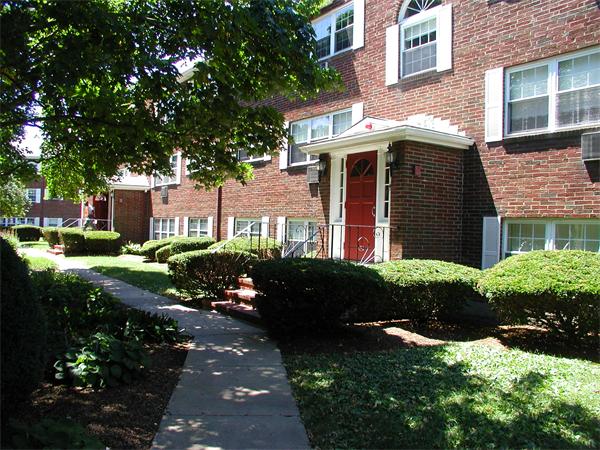 9 Cass Street, Unit 2 Boston, MA 02132 - Photo 3 of 5 a front view of a house with a yard