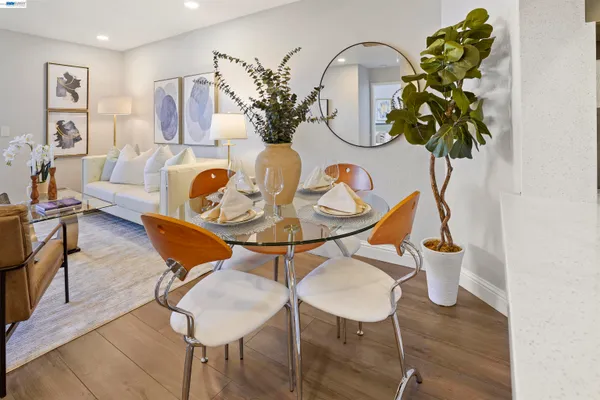 a view of a dining room with furniture and wooden floor