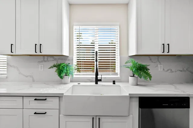 a kitchen with a sink and window