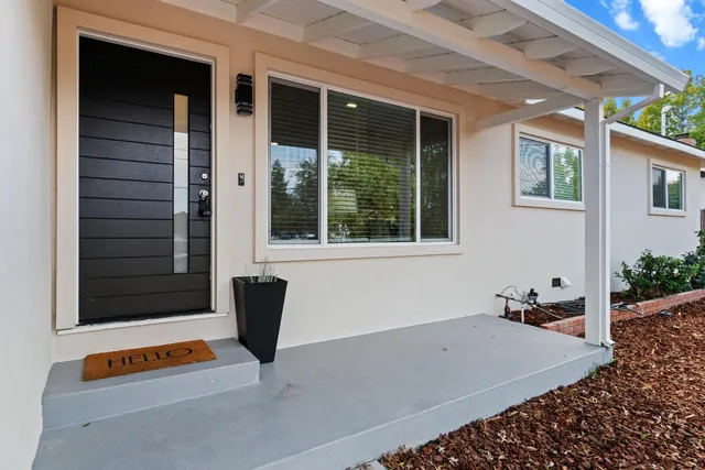 a backyard of a house with seating space
