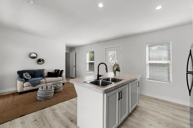 a kitchen that has a lot of cabinets