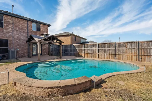 a view of a house with a swimming pool