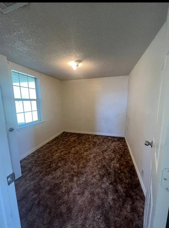 3133 Tbd County Road Lone Oak, TX 75453 - Photo 7 of 21 Brown shag carpeting, white walls, and a window with horizontal muntins