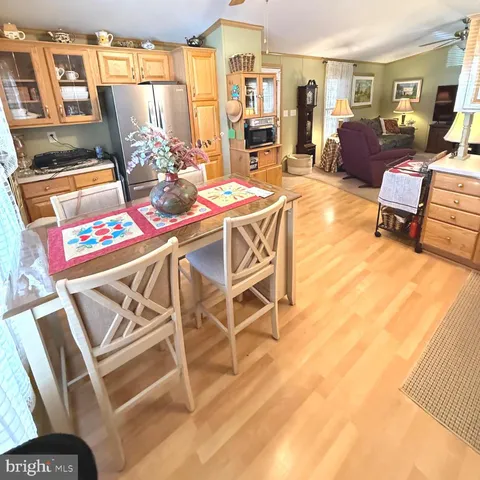 a view of a livingroom with furniture and a flat screen tv