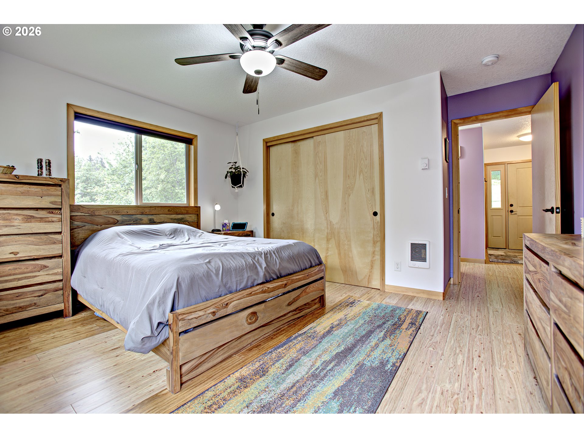 60300 Rays Way St. Helens, OR 97051 - Photo 13 of 41 a spacious bedroom with a bed and wooden floor