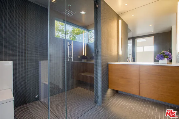a bathroom with a tub and a painting on the wall