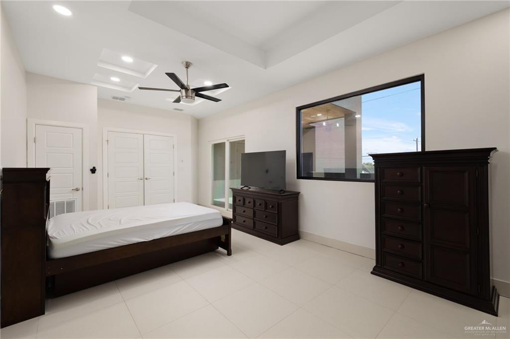 801 East Azucar Avenue Pharr, TX 78577 - Photo 13 of 19 Bedroom featuring visible vents, recessed lighting, a closet, baseboards, and ceiling fan