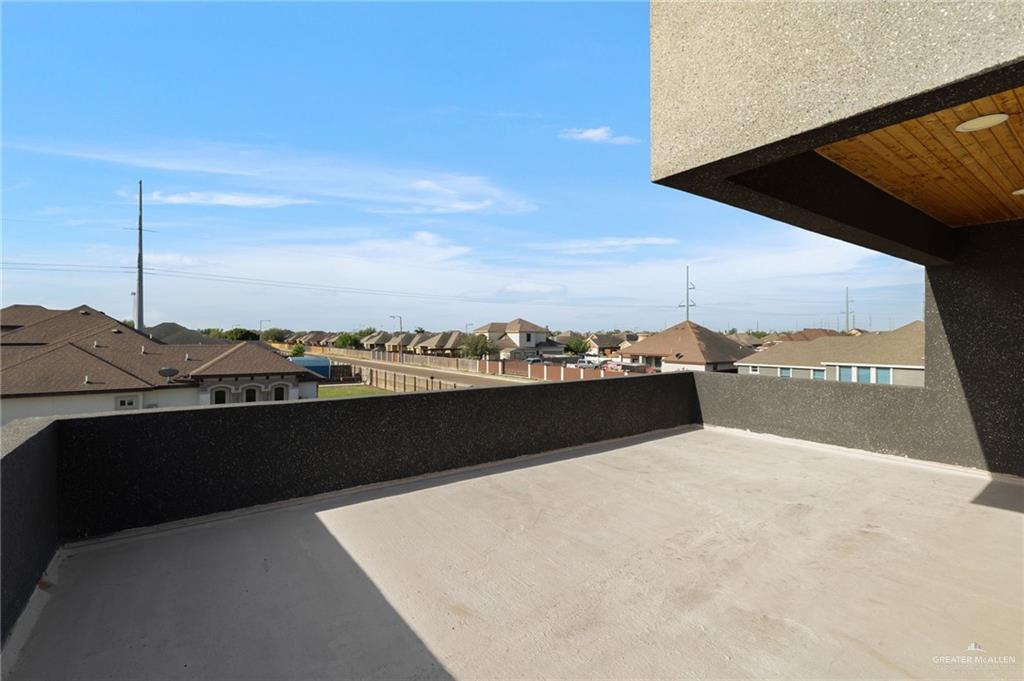 801 East Azucar Avenue Pharr, TX 78577 - Photo 16 of 19 View of patio with a balcony and a residential view